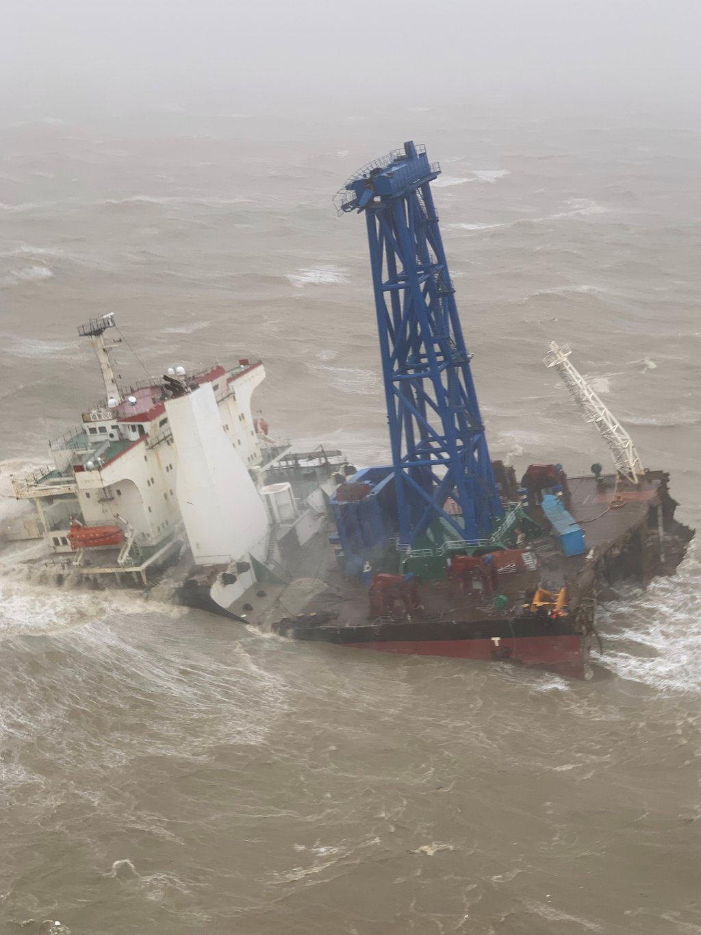 A rescue operation is still under way after an engineering vessel was damaged in rough seas. Photo: Government Flying Service