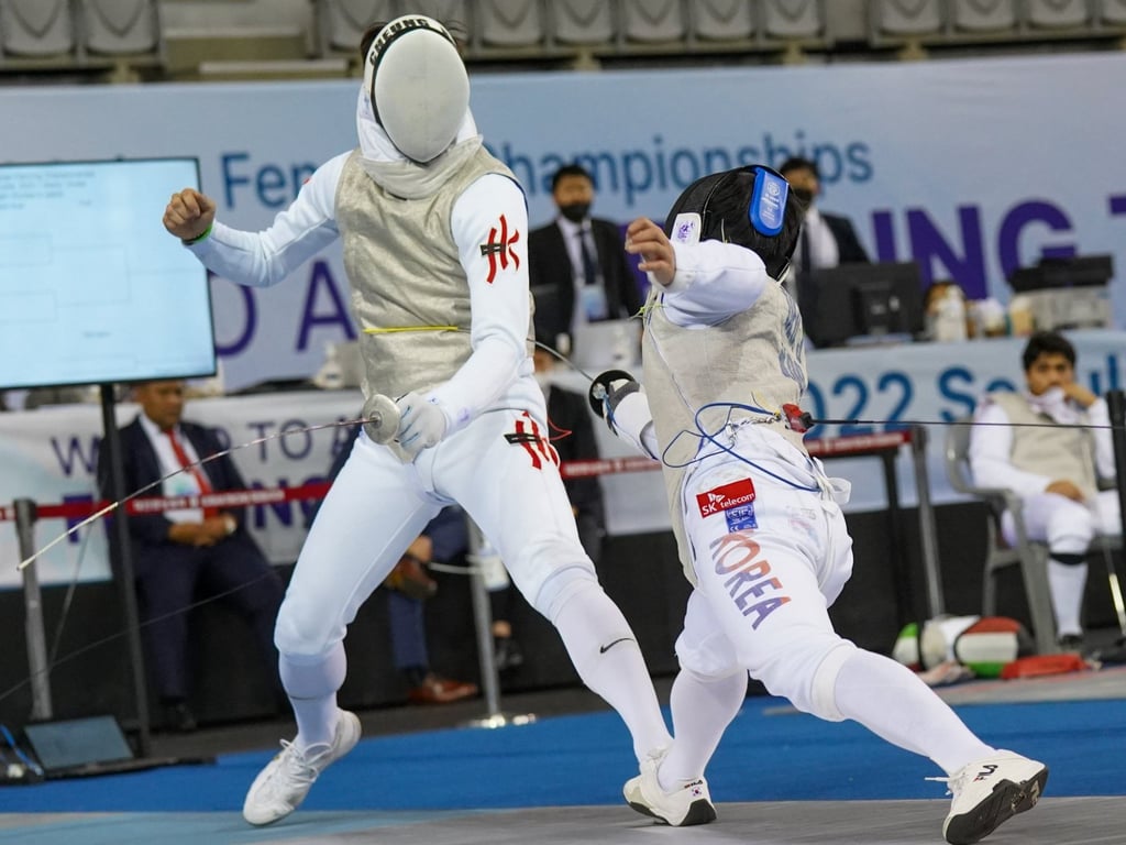 Cheung Ka-long (left) in action last month in the regional championships in Seoul. Photo: FIE