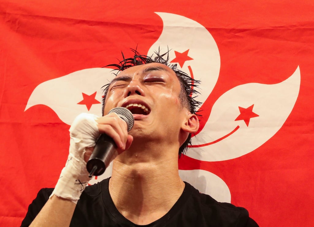 Rex Tso Sing-yu is emotional after beating Kohei Kono in a brutal bout at the Hong Kong Convention and Exhibition Centre in Wan Chai. Photo: Edward Wong