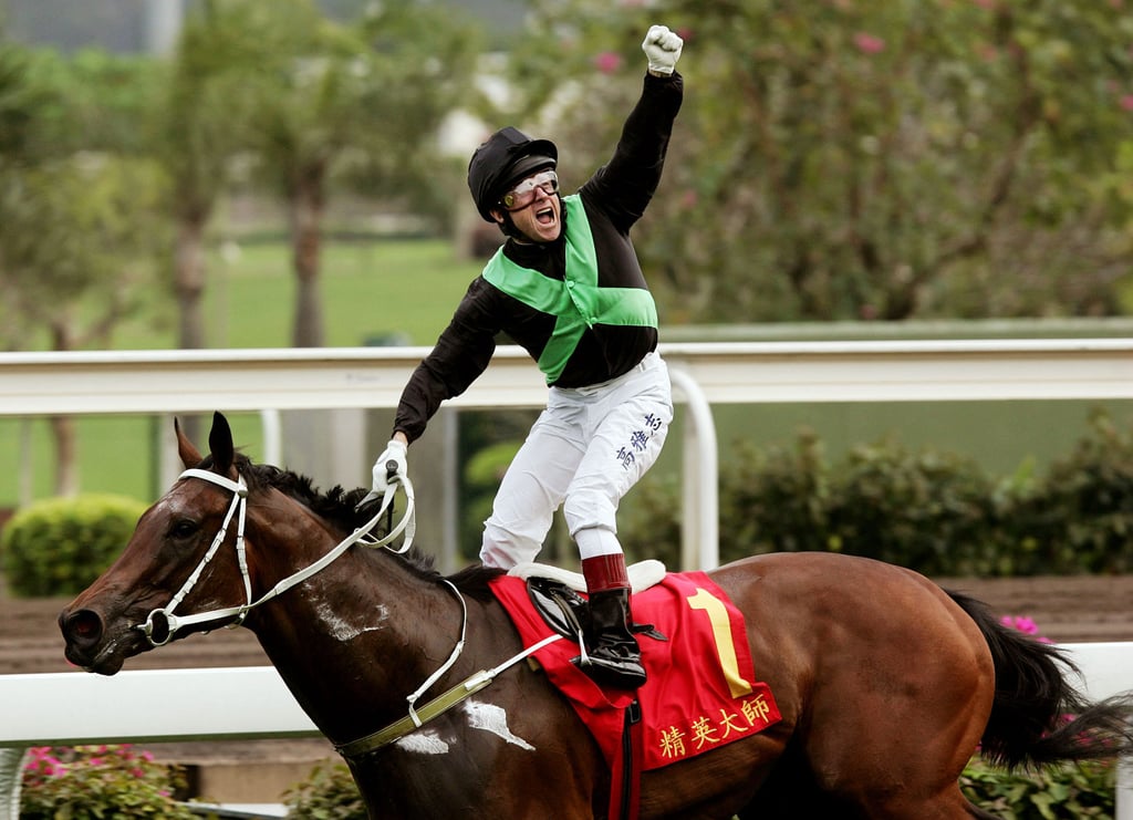 Jockey Felix Coetzee celebrates as he and Silent Witness win the 1,200-metre Group 1 in the Chairman’s Sprint Prize at Sha Tin in 2005 – a 16th straight victory. Photo: Reuters