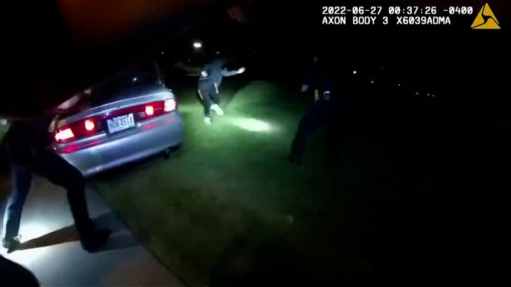 Jayland Walker exits his car and runs before he was shot to death by up police officers in Akron, Ohio, US on June 27 in an image from police body camera video. Photo: City of Akron / Handout via Reuters