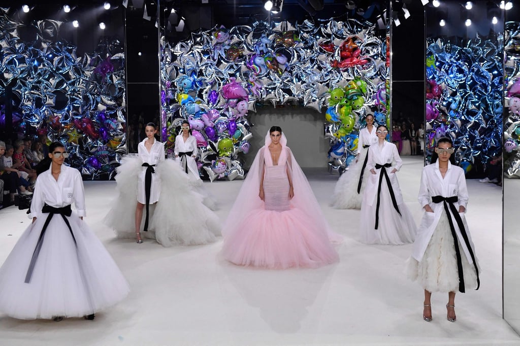 Models emerged from a wall of shiny, whimsical party balloons at Giambattista Valli’s women’s haute couture autumn/winter 2022-2023 show as part of the Fashion Week in Paris, on July 4. Photo: AFP