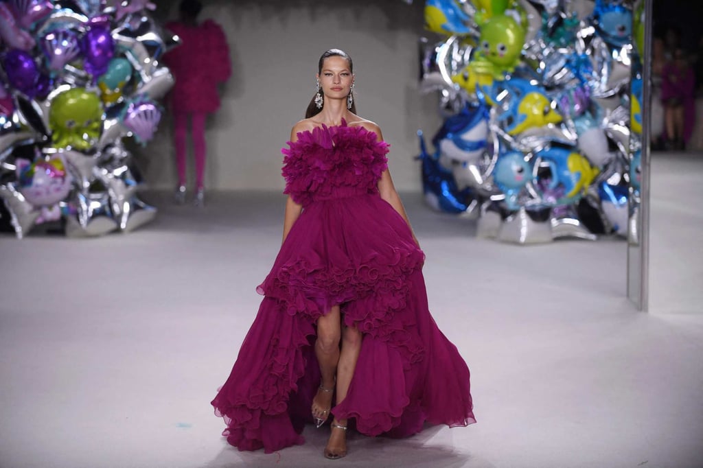 A maroon, ruffled gown with a dramatic, high-low skirt at the Giambattista Valli women’s haute couture autumn/winter 2022-2023 collection during a fashion show as part of the Fashion Week in Paris, on July 4. Photo: AFP