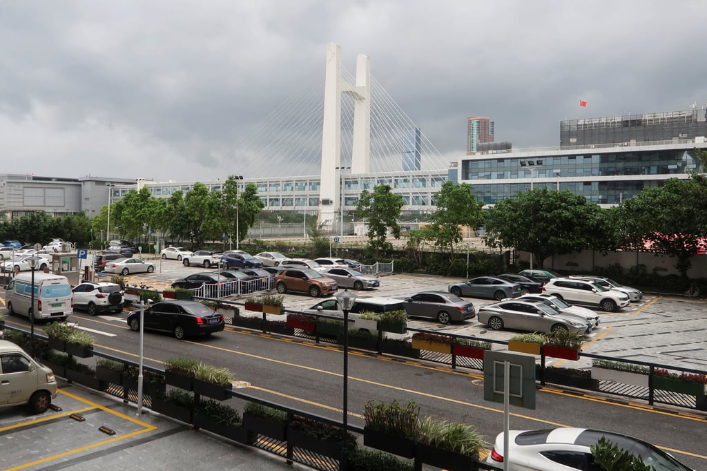 Cars park beside Futian Checkpoint, one of the border crossings to Hong Kong, in Shenzhen. Photo: Reuters