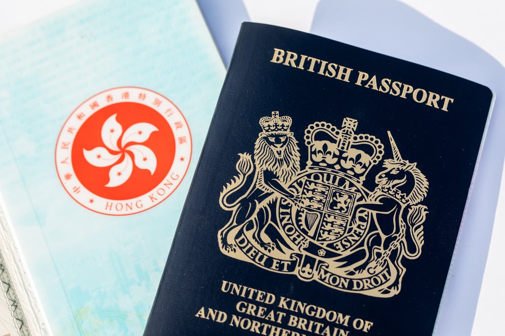 Thousands of holders of a British National (Overseas) passport, shown with a Hong Kong Special Administrative Region passport, were allowed to leave Hong Kong. Photo: Bloomberg
