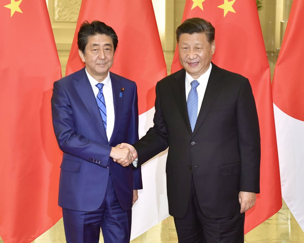 Abe with Chinese President Xi Jinping in Beijing in 2019. The Japanese leader’s signature economic strategy, Abenomics, aimed to bring back the boom years of the 1980s. Photo: Kyodo