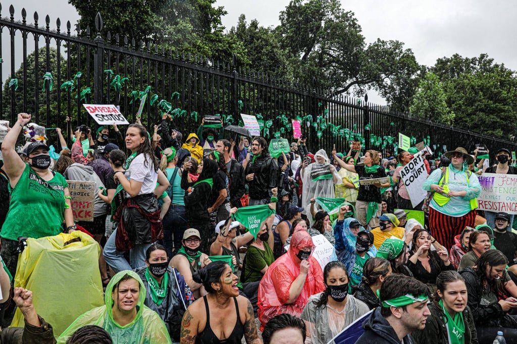 Demonstrators hold a sit-in in front of the White House during a Women’s March rally in Washington, D.C., US, on Saturday. Photo: Bloomberg