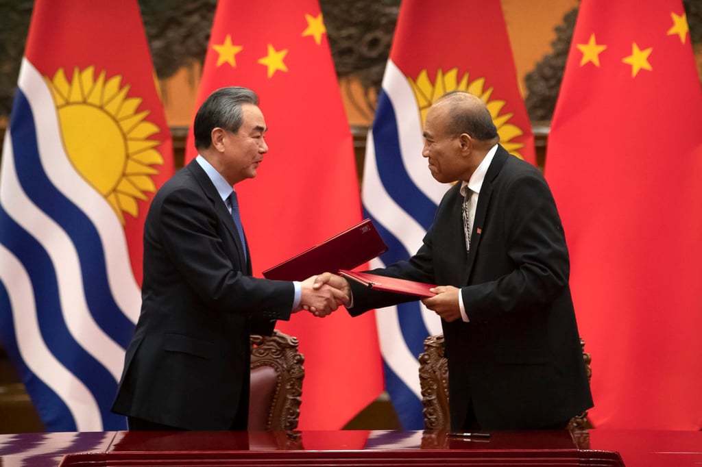 Kiribati’s President Taneti Maamau shake hands with Chinese Foreign Minister Wang Yi during a signing ceremony at the Great Hall of the People in January 2020. Photo: AP