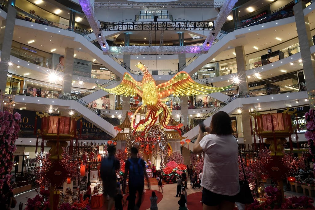Visitors walk past a giant rooster installation as part of Chinese Lunar New Year celebrations in 2017 at the Pavilion Kuala Lumpur shopping centre. Photo: AFP Visitors walk past a giant rooster installation as part of Chinese Lunar New Year celebrations in 2017 at the Pavilion Kuala Lumpur shopping centre. Photo: AFP