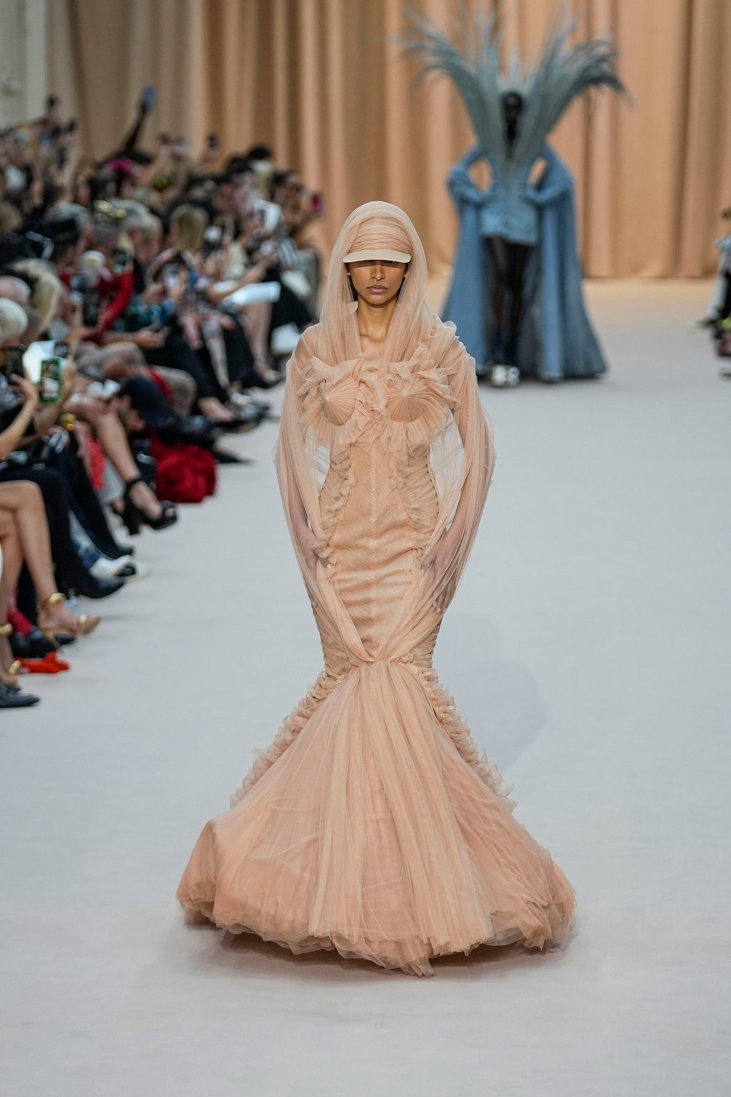 A model wears an hourglass creation as part of Jean Paul Gaultier’s haute couture collection. Photo: AP