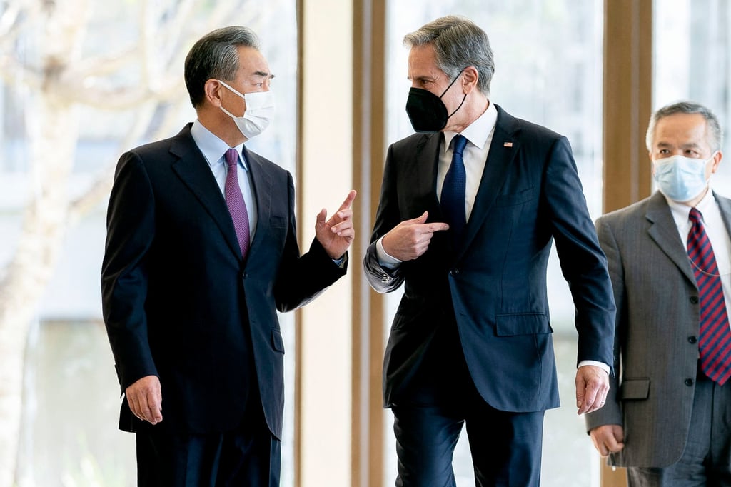 China’s Foreign Minister Wang Yi speaks with US Secretary of State Antony Blinken before their meeting in Bali on Saturday. Photo: AFP