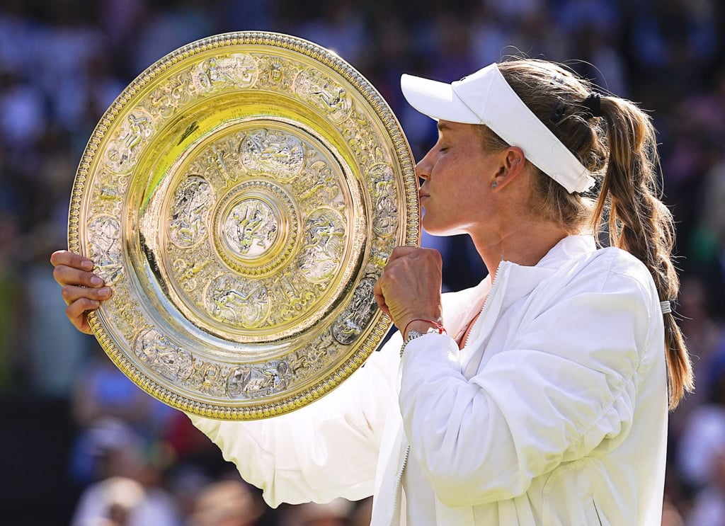 Elena Rybakina of Kazakhstan kisses the trophy after winning the women’s singles final against Ons Jabeur of Tunisia at the Wimbledon tennis championships in London, on July 9. Photo: Kyodo