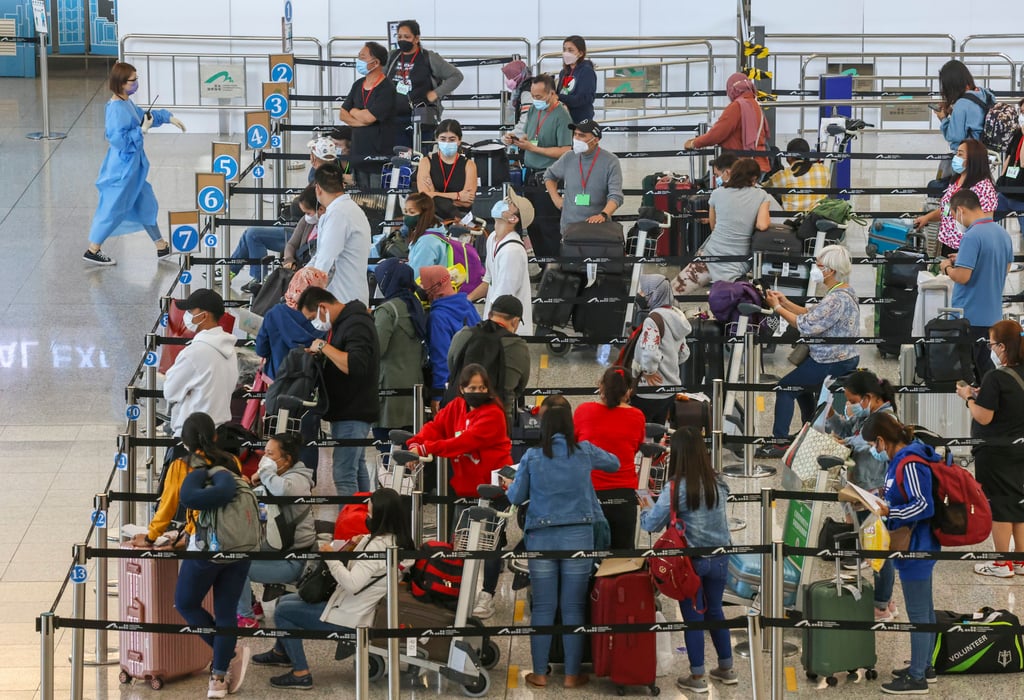 Travellers at Hong Kong International Airport wait to be transported to their quarantine facilities. Photo: K. Y. Cheng Travellers at Hong Kong International Airport wait to be transported to their quarantine facilities. Photo: K. Y. Cheng