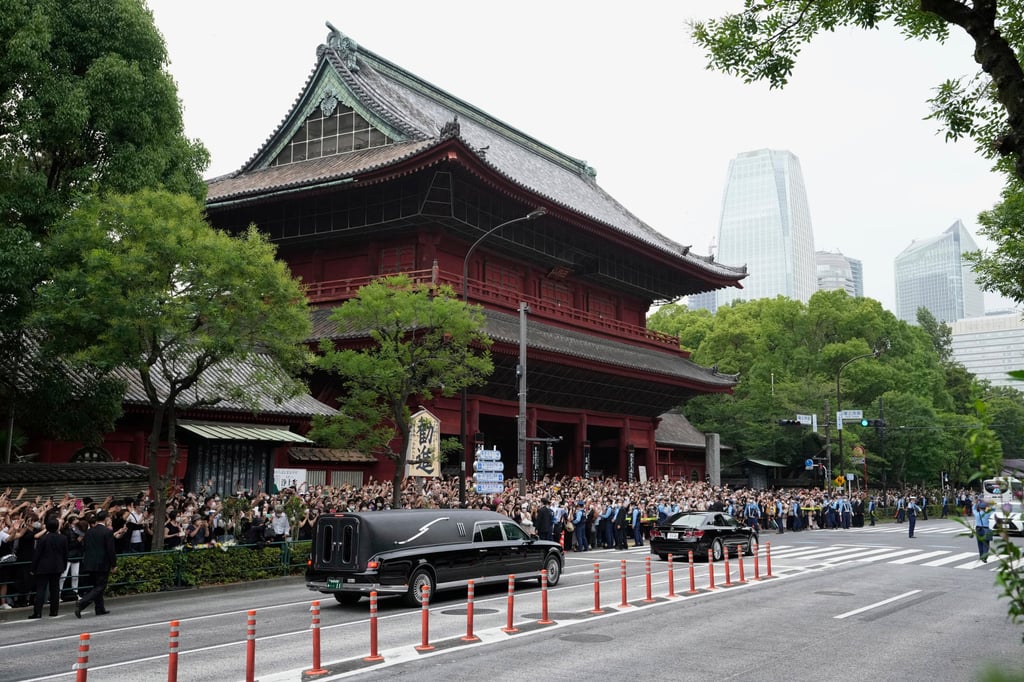 A hearse carrying the body of Shinzo Abe leaves Zojoji temple in Tokyo after his funeral on Tuesday. Photo: AP A hearse carrying the body of Shinzo Abe leaves Zojoji temple in Tokyo after his funeral on Tuesday. Photo: AP