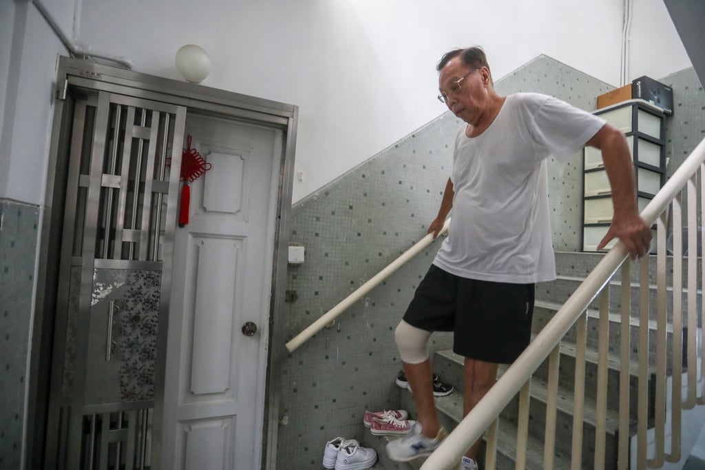 Tsang Yuk-kwan, 82, pictured on July 7, 2022, has difficulty climbing the stairs to his fifth-floor flat and hopes the Urban Renewal Authority will speed up redevelopment of such buildings. Photo: SCMP / Jonathan Wong Tsang Yuk-kwan, 82, pictured on July 7, 2022, has difficulty climbing the stairs to his fifth-floor flat and hopes the Urban Renewal Authority will speed up redevelopment of such buildings. Photo: SCMP / Jonathan Wong