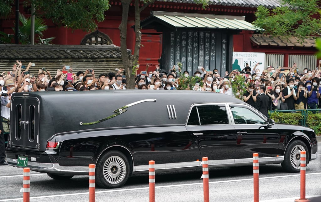 A vehicle carrying the body of former Prime Minister Shinzo Abe during his funeral procession in Tokyo on Tuesday. Photo: EPA-EFE A vehicle carrying the body of former Prime Minister Shinzo Abe during his funeral procession in Tokyo on Tuesday. Photo: EPA-EFE