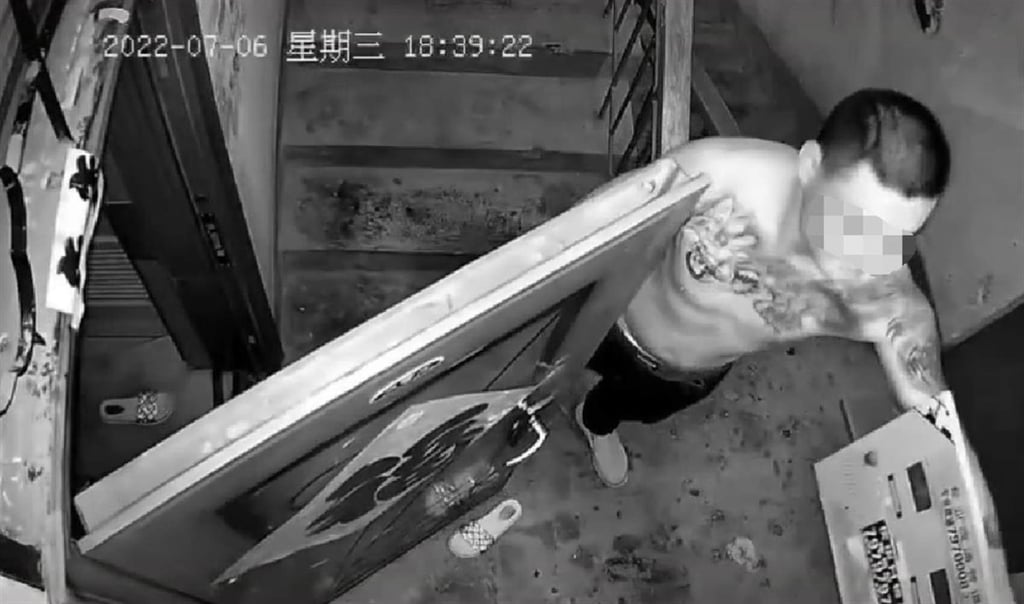 A later surveillance video showed the man stepping outside the home to check an electricity metre. Photo: Weibo A later surveillance video showed the man stepping outside the home to check an electricity metre. Photo: Weibo