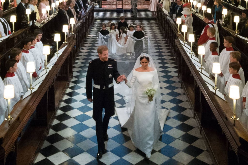 Prince Harry, Duke of Sussex and his wife Meghan Markle, Duchess of Sussex leave St George’s Chapel after their wedding ceremony in Windsor Castle. Photo: AFP