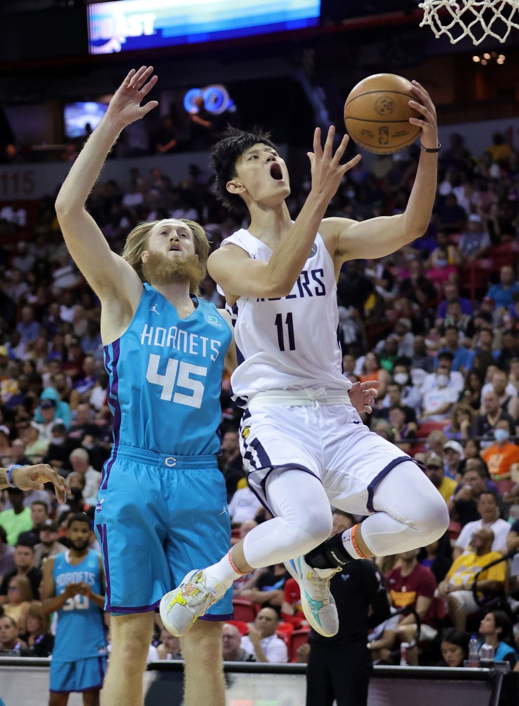 Fanbo Zeng of the Indiana Pacers drives to the basket against Brady Manek of the Charlotte Hornets during an NBA Summer League game at the Thomas & Mack Centre in Las Vegas. Photo: AFP Fanbo Zeng of the Indiana Pacers drives to the basket against Brady Manek of the Charlotte Hornets during an NBA Summer League game at the Thomas & Mack Centre in Las Vegas. Photo: AFP