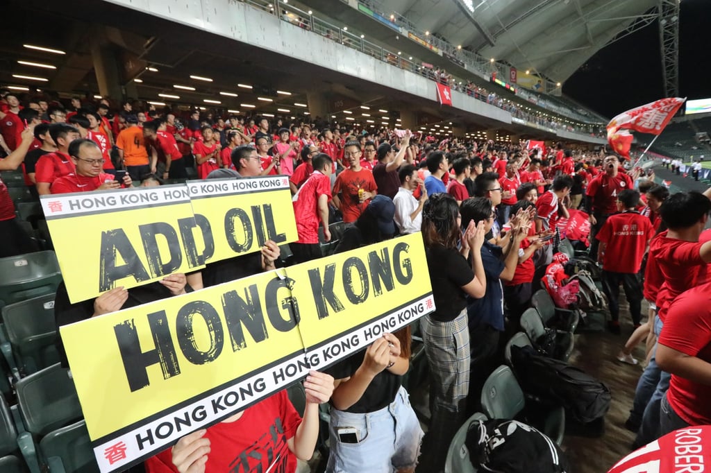 Football fans with an “add oil, Hong Kong” sign at the Hong Kong vs Iran 2022 Fifa World Cup qualifying match in Happy Valley, Hong Kong. Photo: Felix Wong