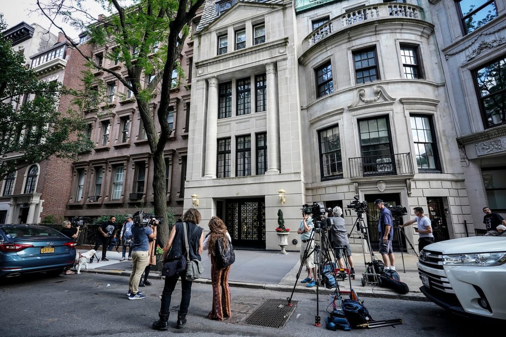 Media gather outside the residence of Ivana Trump after she was found dead at home on July 14 in New York. Photo: AP
