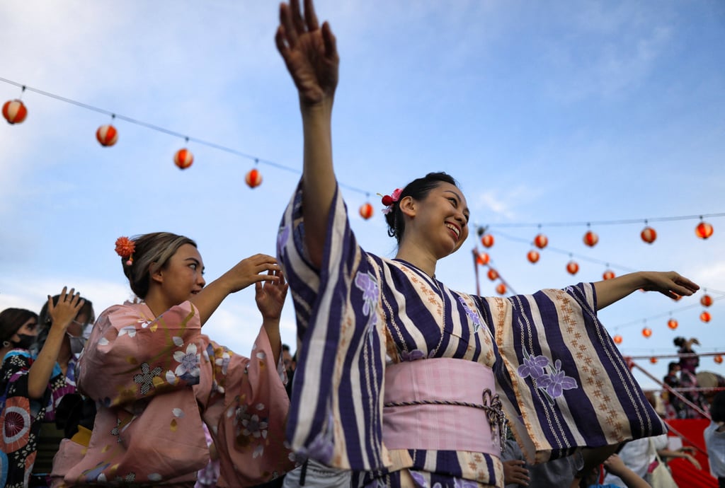 Women clad in traditional Japanese yukata dance during the Bon Odori festival in Shah Alam. Photo: Reuters Women clad in traditional Japanese yukata dance during the Bon Odori festival in Shah Alam. Photo: Reuters
