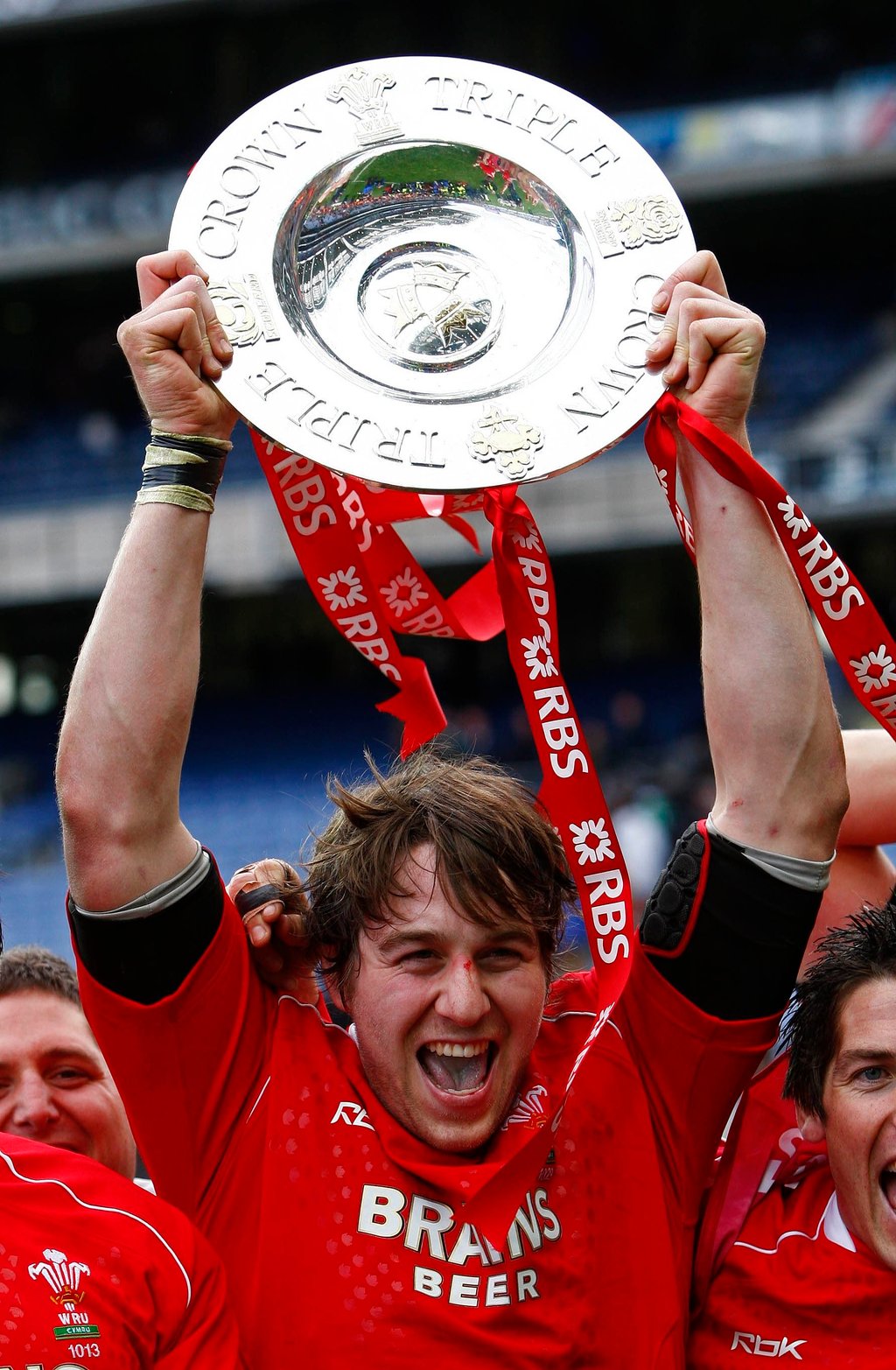 Ryan Jones of Wales lifts the Triple Crown trophy after beating Ireland in their Six Nations rugby in 2008. Photo: Reuters