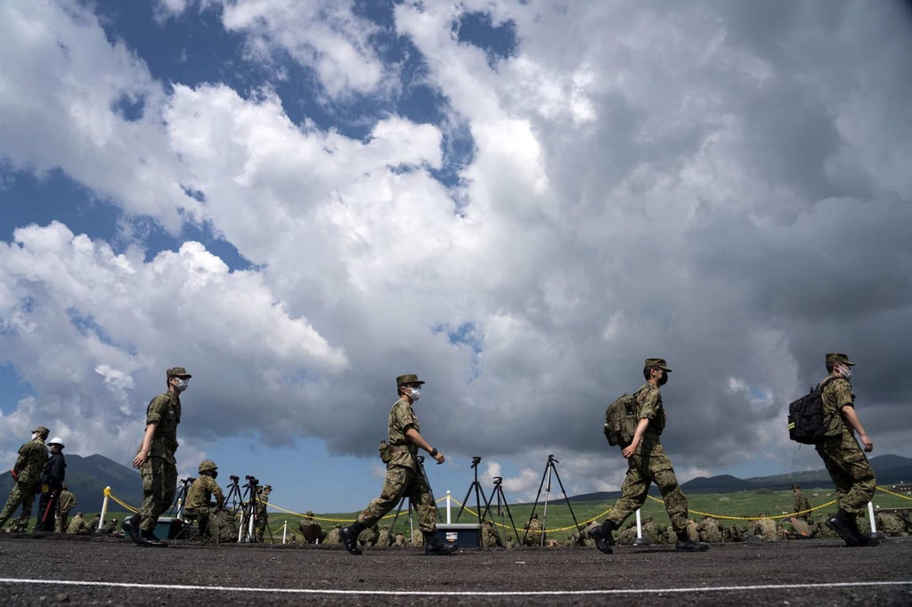 Members of the Japan Ground Self-Defense Force attend a live fire exercise at the East Fuji Maneuver Area in Gotemba on May 28. File photo: AFP