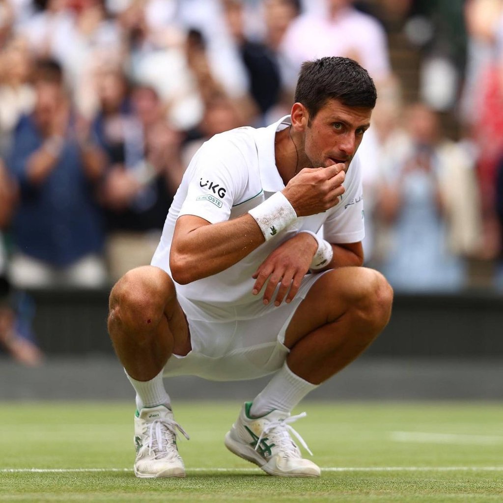 Novak Djokovic eats the grass on Wimbledon’s Centre Court, which has now become an odd tradition for the athlete. Photo: @djokernole/Instagram