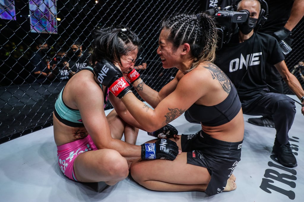 Angela Lee (right) embraces Stamp Fairtex after a submission win at ONE X. Photo: ONE Championship.