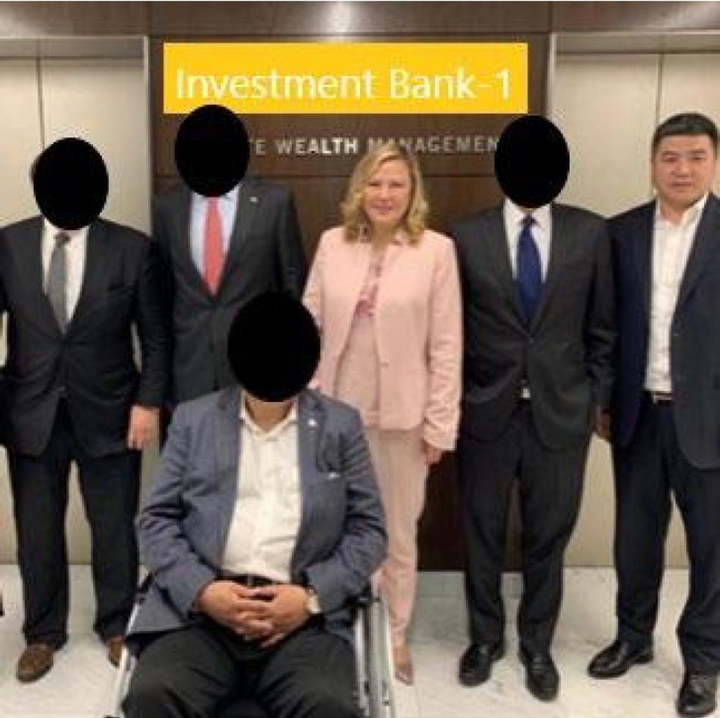 Sherry Li and Lianbo Wang are seen with employees at an investment bank in Washington in August 2019. Photo: US Justice Department