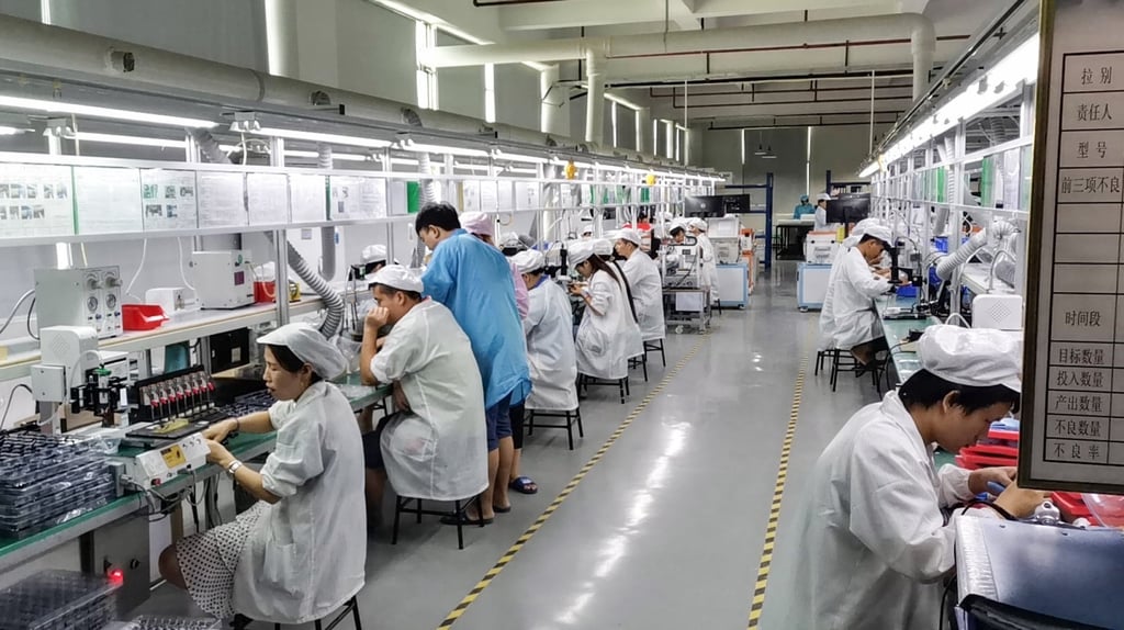 A production line inside the factory of Dongguan Koppo Electronics Co, a major Bluetooth headphone maker in China. Photo: Handout A production line inside the factory of Dongguan Koppo Electronics Co, a major Bluetooth headphone maker in China. Photo: Handout