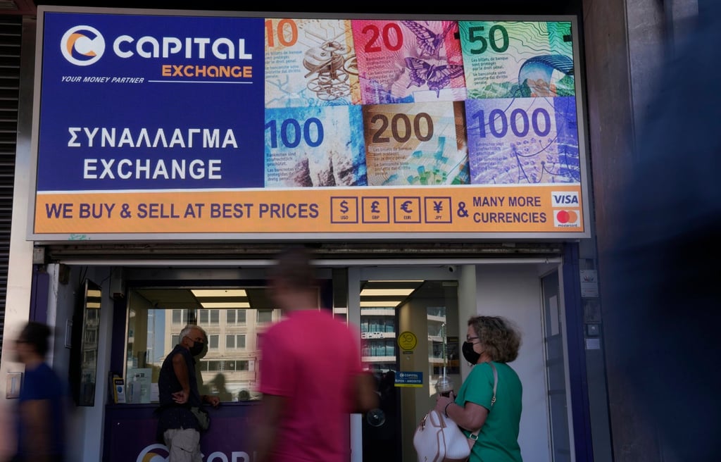 An exchange bureau in Athens, Greece, on July 13. Last week, the euro hit parity with the US dollar for the first time in nearly 20 years. Photo: AP