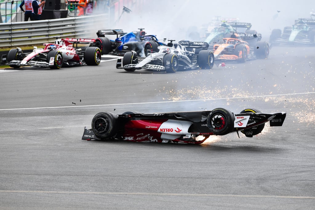 (220704) – LONDON, July 4, 2022 (Xinhua) – Alfa Romeo’s Chinese driver Zhou Guanyu crashes out at the start of the Formula One British Grand Prix at the Silverstone motor racing circuit in Silverstone, Britain, on July 3, 2022. (Photo by Qian Jun/Xinhua)