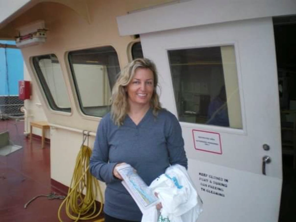 Carolyn Lee after being rescued while sailing from the Philippines to Hong Kong. She is holding a souvenir T-shirt from Maersk. A tanker from the Danish shipping company saved her, her family and crew. Photo: Carolyn Lee Carolyn Lee after being rescued while sailing from the Philippines to Hong Kong. She is holding a souvenir T-shirt from Maersk. A tanker from the Danish shipping company saved her, her family and crew. Photo: Carolyn Lee