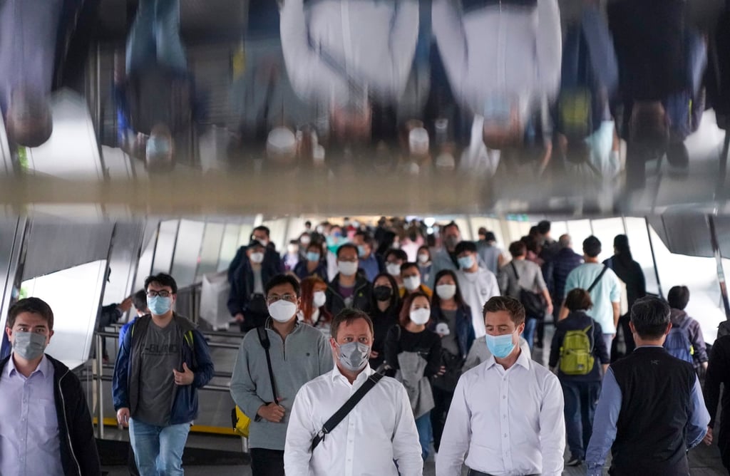 Workers in Hong Kong’s Central district in March 2022. Ties and jackets are optional in some of the city’s most buttoned-down workplaces amid a heat wave. Photo: Felix Wong Workers in Hong Kong’s Central district in March 2022. Ties and jackets are optional in some of the city’s most buttoned-down workplaces amid a heat wave. Photo: Felix Wong