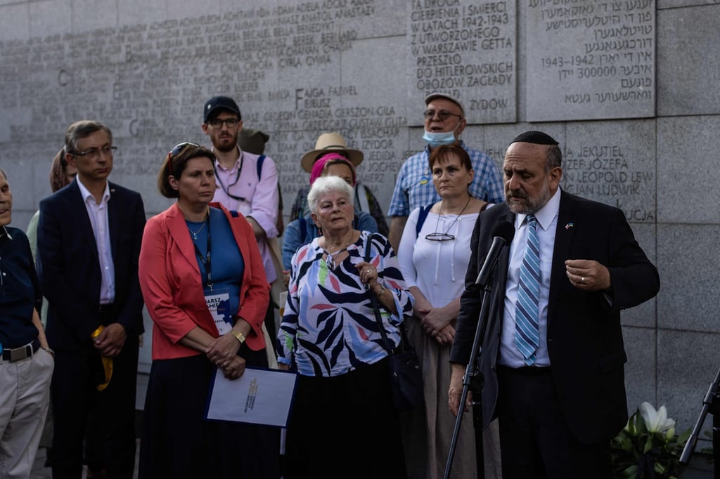 Rabbi Michael Schudrich, right, Poland’s chief rabbi, speaks in Warsaw, Poland on Friday. Photo: AFP