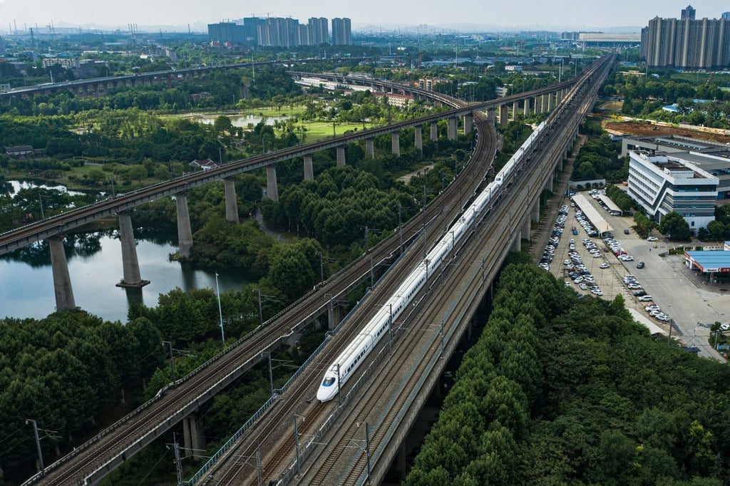 A high-speed train races along the Beijing-Wuhan section of the Beijing-Guangzhou line on June 20, after the top speed on the section was raised from 310km/h to 350km/h. Photo: Xinhua