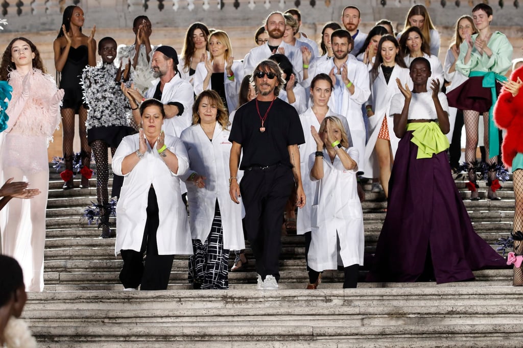 Valentino creative director Pierpaolo Piccioli with his couture studio team after the Valentino haute couture autumn/winter 2022-23 show.