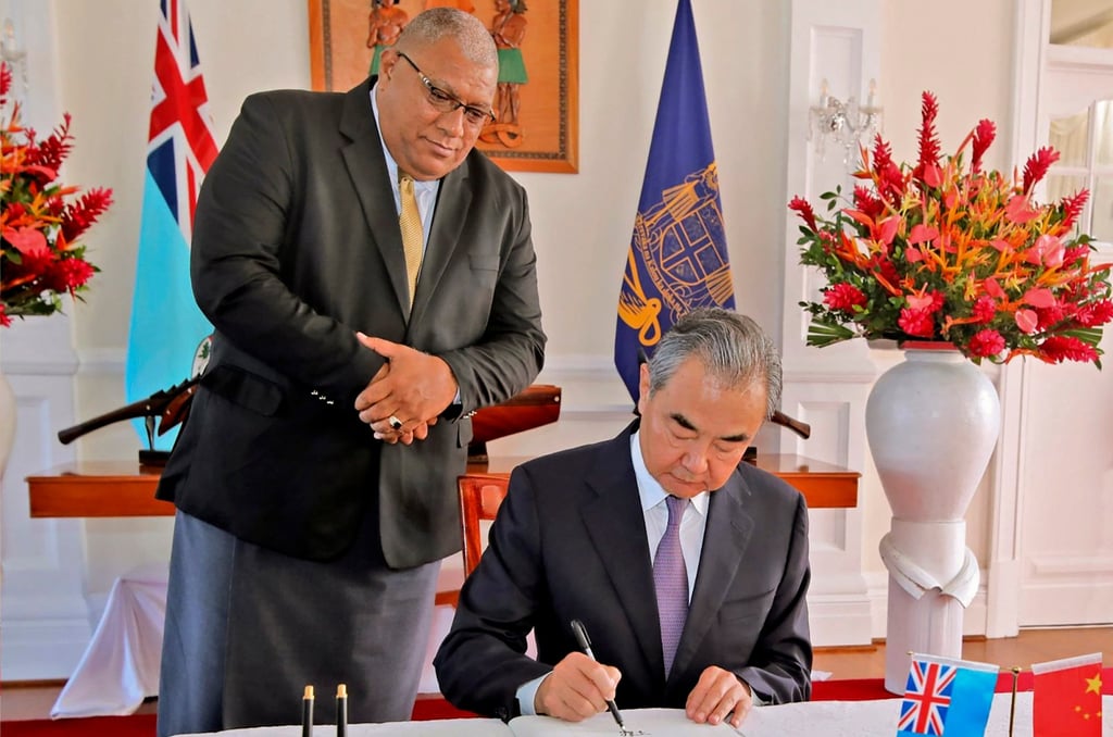Fijian President Ratu Wiliame Katonivere (left) watches as Chinese Foreign Minister Wang Yi signs the visitors book at the State House in Suva on May 30. Wang’s visit to Fiji was part of an eight-nation Pacific Islands tour. Photo: Fiji Government/ AP Fijian President Ratu Wiliame Katonivere (left) watches as Chinese Foreign Minister Wang Yi signs the visitors book at the State House in Suva on May 30. Wang’s visit to Fiji was part of an eight-nation Pacific Islands tour. Photo: Fiji Government/ AP