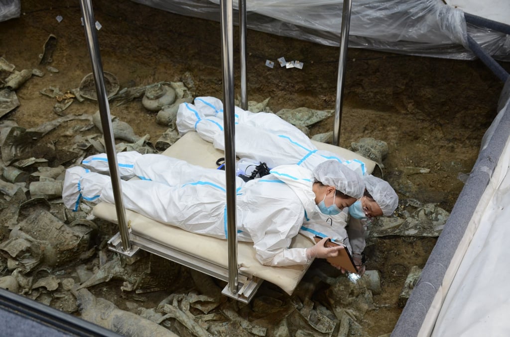 Archaeologists work in one of the sacrificial pits at the Sanxingdui site in Sichuan province. Photo: Handout Archaeologists work in one of the sacrificial pits at the Sanxingdui site in Sichuan province. Photo: Handout