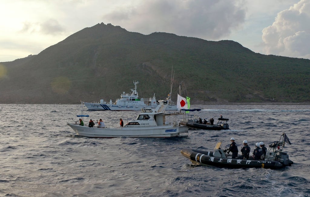 Japanese coastguard vessel and boats seen near the disputed Diaoyu Islands, which Japan administers and calls the Senkakus. Photo: AP