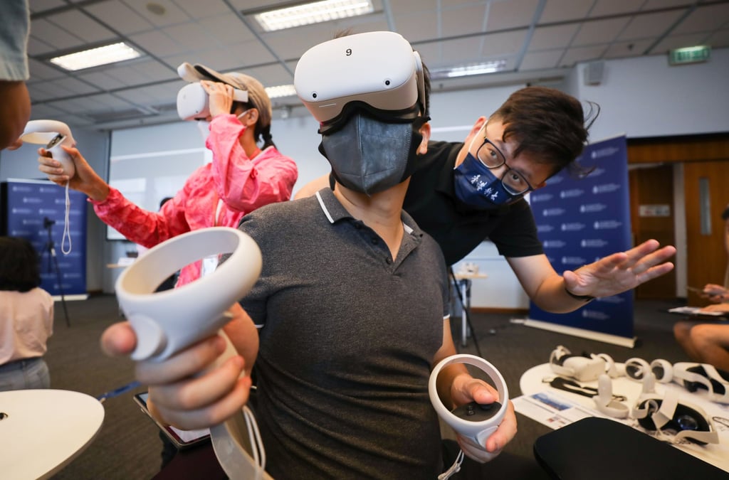Students can enter HKUST’s campus in the metaverse by wearing virtual reality headsets. Photo: Xiaomei Chen Students can enter HKUST’s campus in the metaverse by wearing virtual reality headsets. Photo: Xiaomei Chen