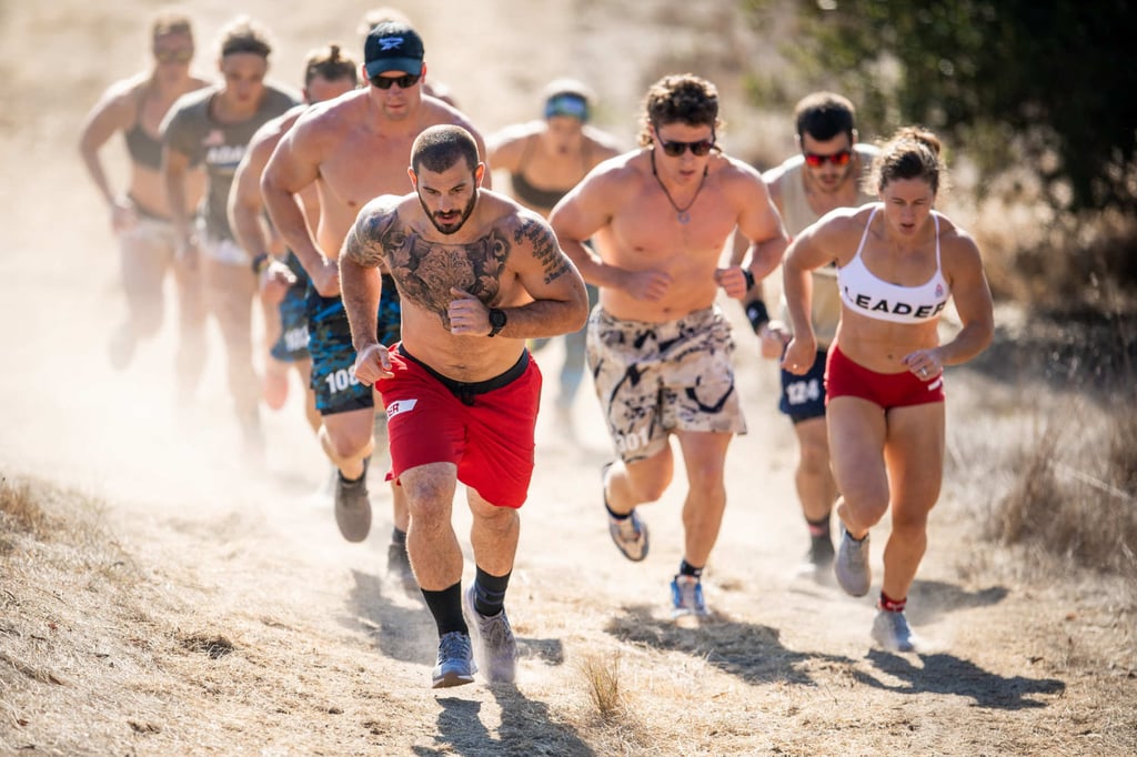 Mat Fraser leading the pack, with Justin Medeiros over his left shoulder, during the trail run at the CrossFit Games 2020. Photo: CrossFit Games Mat Fraser leading the pack, with Justin Medeiros over his left shoulder, during the trail run at the CrossFit Games 2020. Photo: CrossFit Games