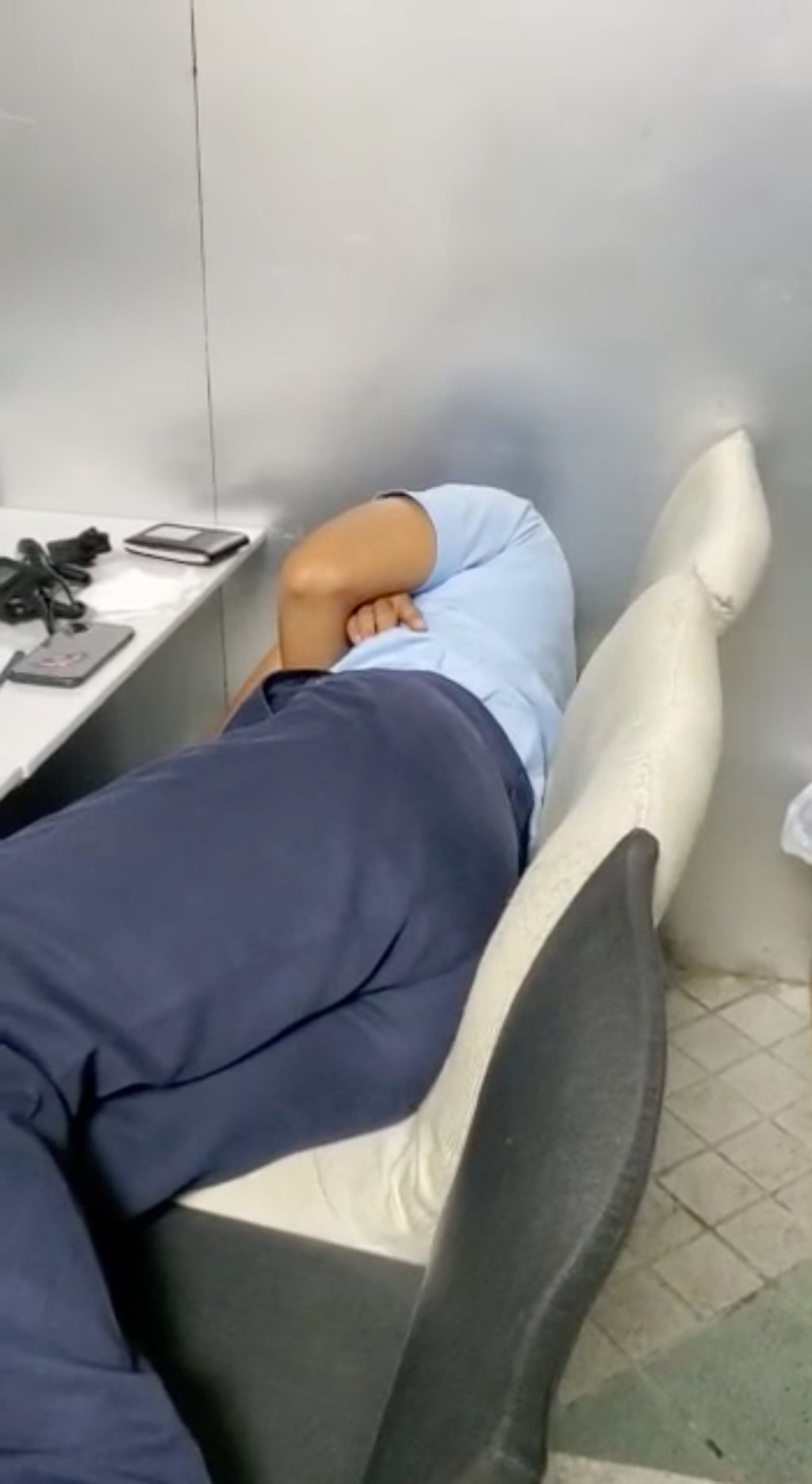 A screenshot of the clip, which shows the officer taking a nap. Photo: Handout A screenshot of the clip, which shows the officer taking a nap. Photo: Handout