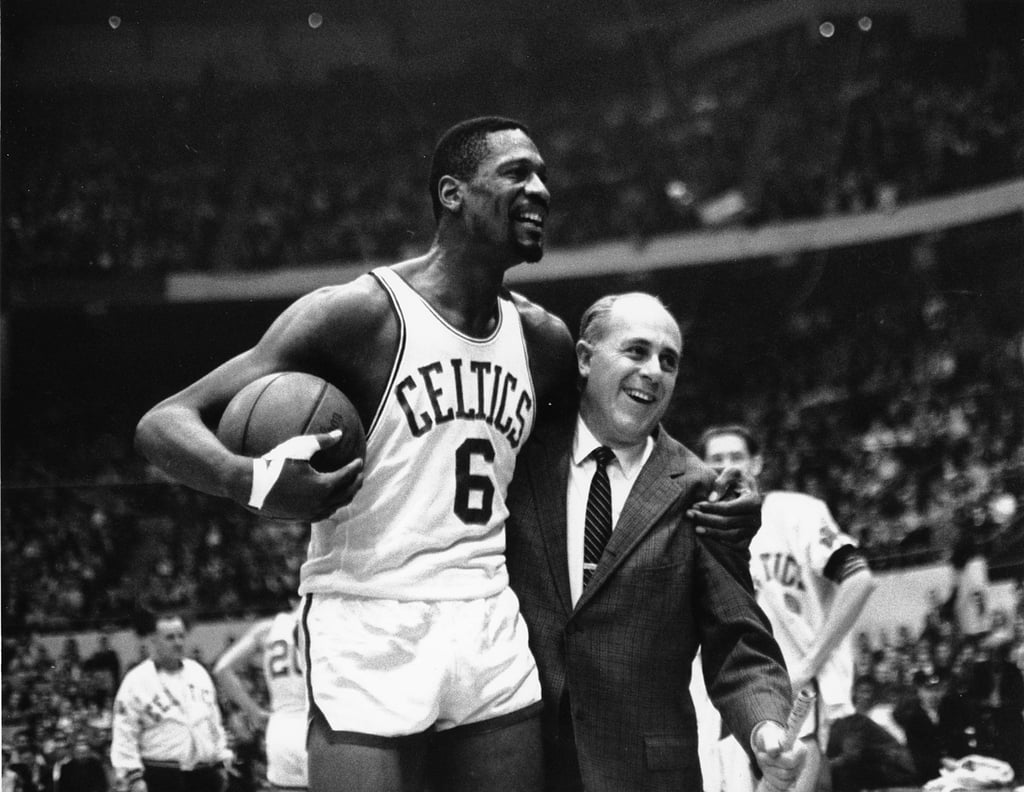 Bill Russell, left, star of the Boston Celtics, and Celtic’s coach Arnold ‘Red’ Auerbach in Boston Garden in 1964. Photo: AP