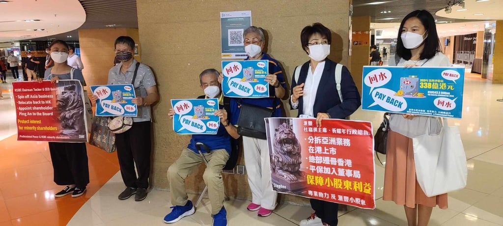 Sai Kung’s district councilor Christine Fong Kwok-shan (second right) led a group of minority shareholders in demanding for HSBC to pay them a dividend cancelled in 2020, at the Kowloon Bay International Exhibition Centre on August 2, 2022. Photo: Enoch Yiu.