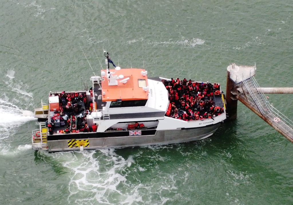 A group of people thought to be migrants are brought in to Ramsgate, on board a Border Force vessel following a small boat incident in the Channel. Photo: dpa A group of people thought to be migrants are brought in to Ramsgate, on board a Border Force vessel following a small boat incident in the Channel. Photo: dpa
