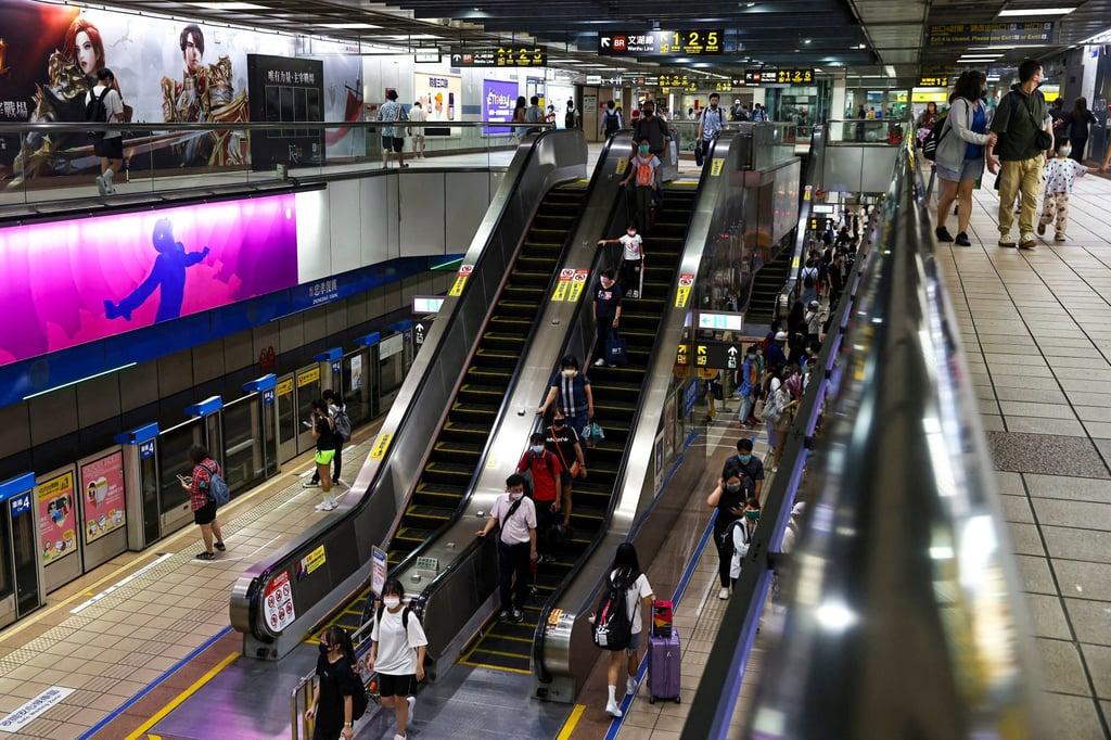 Commuters take an escalator in an underground subway station in Taipei that will be used as an air-raid shelter in the event of an attack. Photo: Reuters