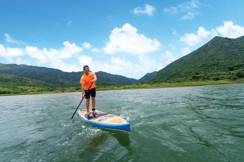 Stand-up paddleboard coach Edmund Lai says the activity is a great way for people to connect with Mother Nature. Stand-up paddleboard coach Edmund Lai says the activity is a great way for people to connect with Mother Nature.
